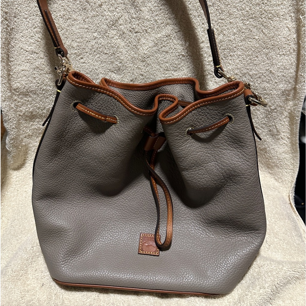 Dooney and Bourke leather drawstring tote.